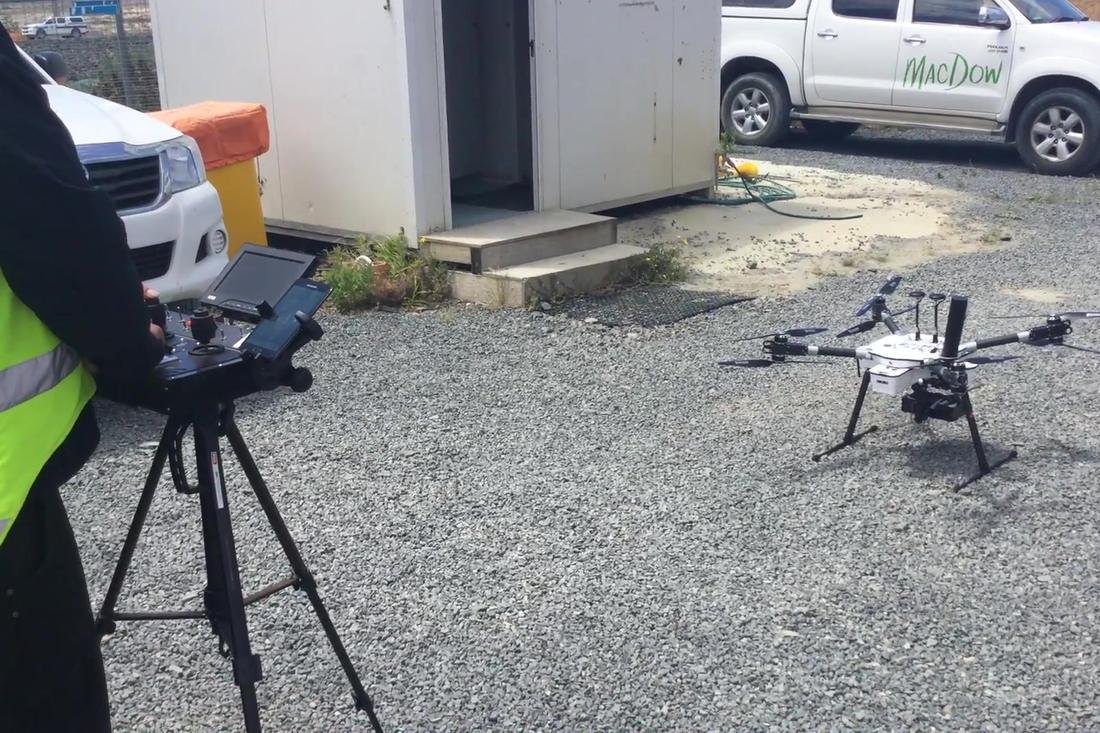 Survey drone and ground controller set up on a construction site
