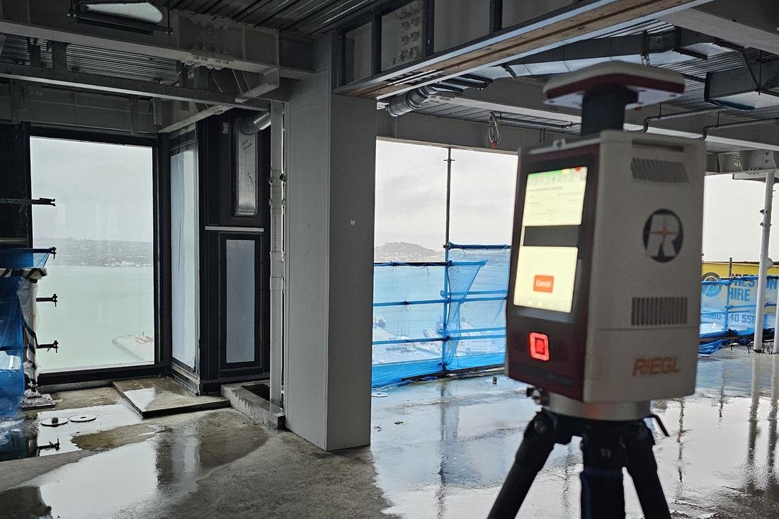 RIEGL terrestrial laser scanner set up inside a building under construction
